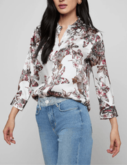 Side view of L’AGENCE Dani silk blouse in butterfly jungle print