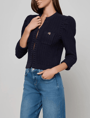side view of L’AGENCE Delli Cropped Textured Cardigan showing cropped hem.