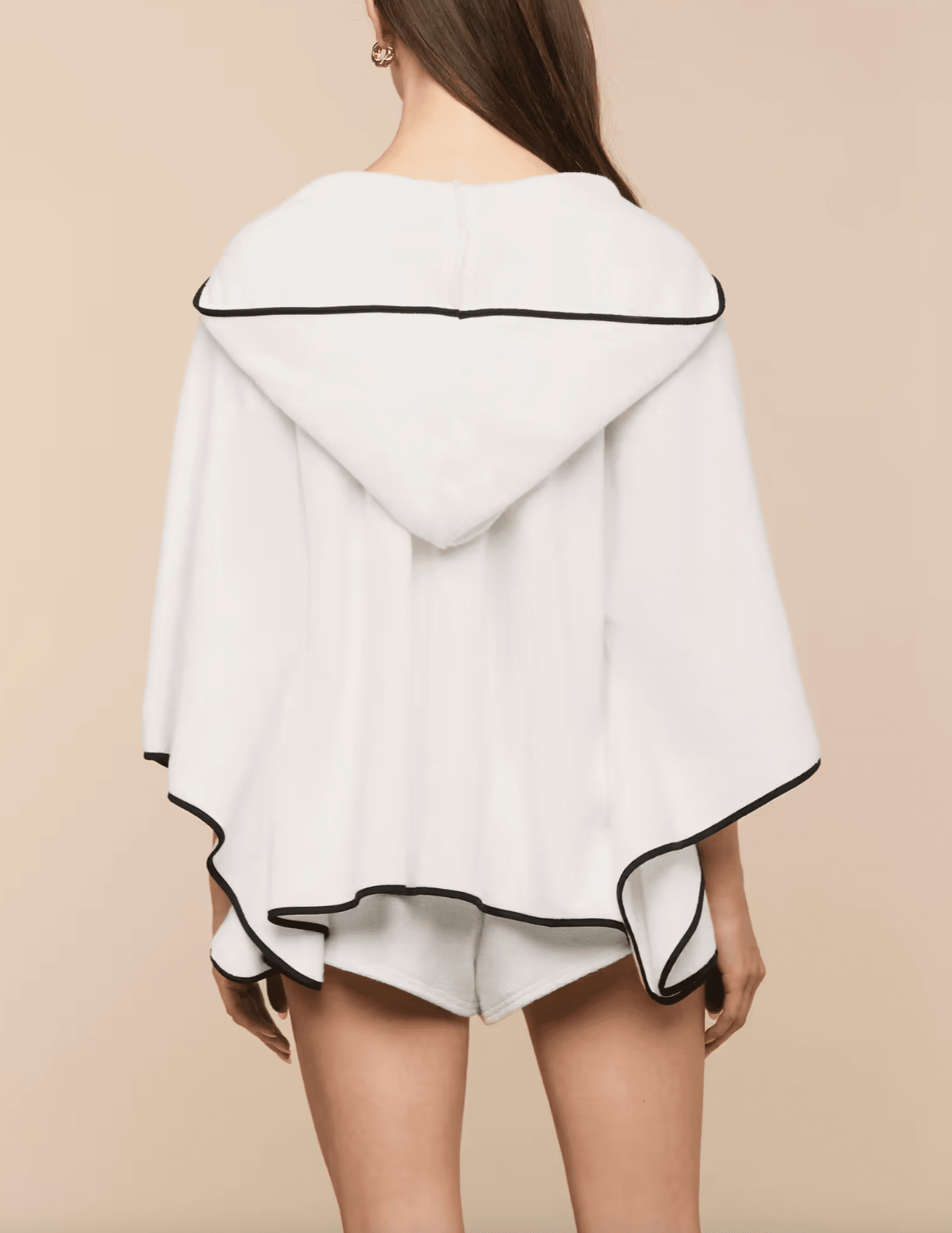 Back view of LAGENCE Demeter white hooded poncho cover up