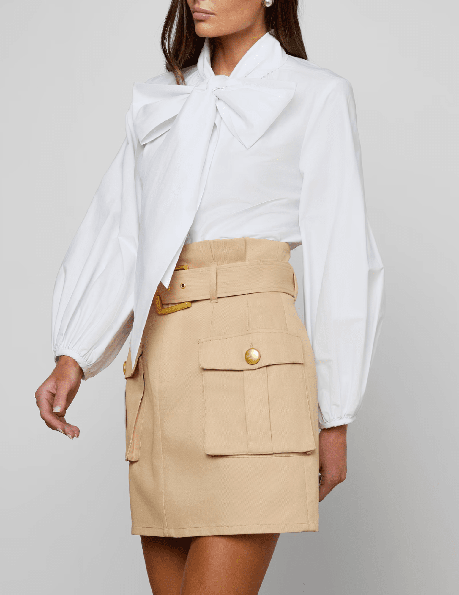 Side view of L’AGENCE Deon white blouse with blouson sleeves