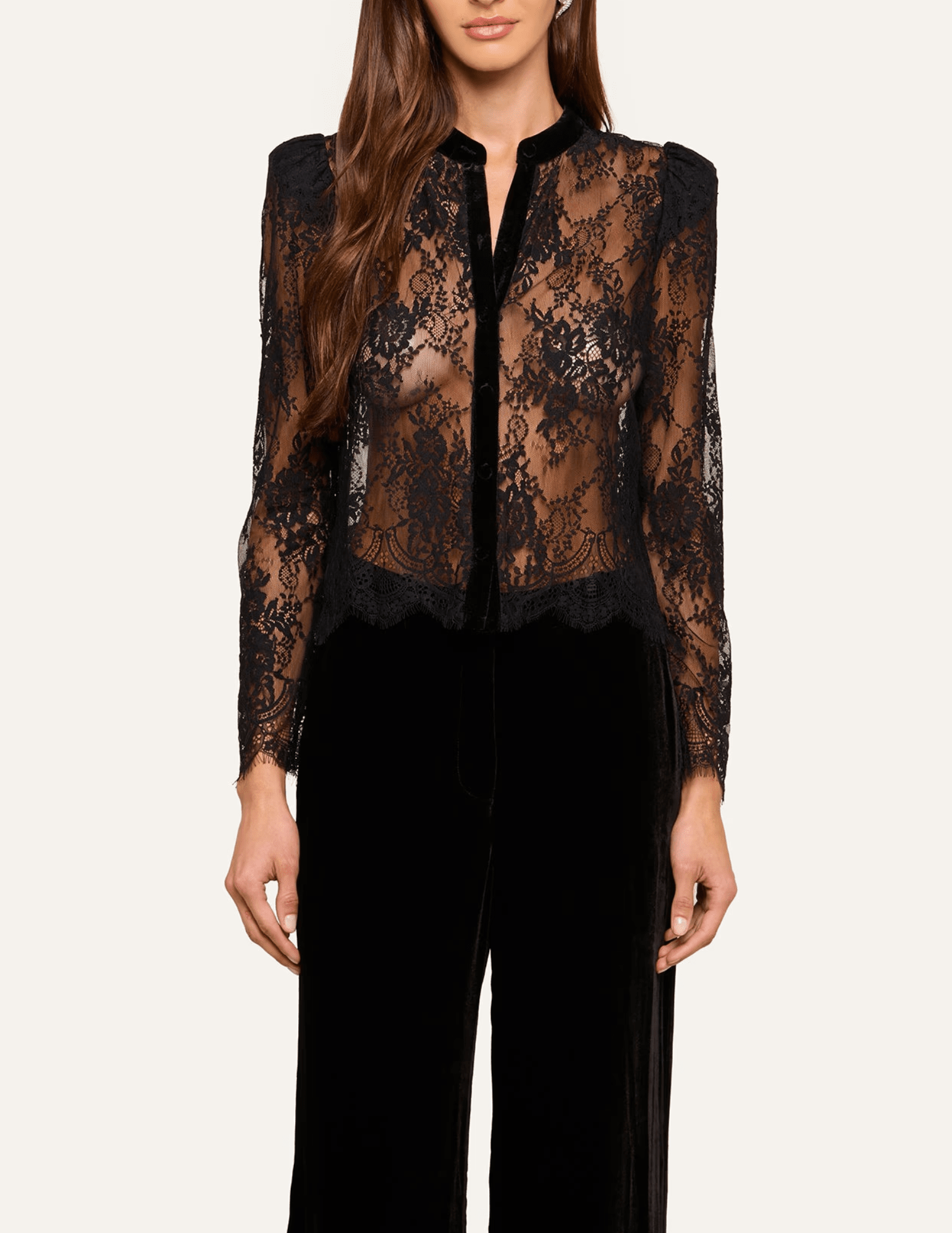 Front view of L'AGENCE Dorothea black lace blouse styled with elegant black wide-leg trousers.