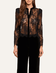 Front view of L'AGENCE Dorothea black lace blouse styled with elegant black wide-leg trousers.