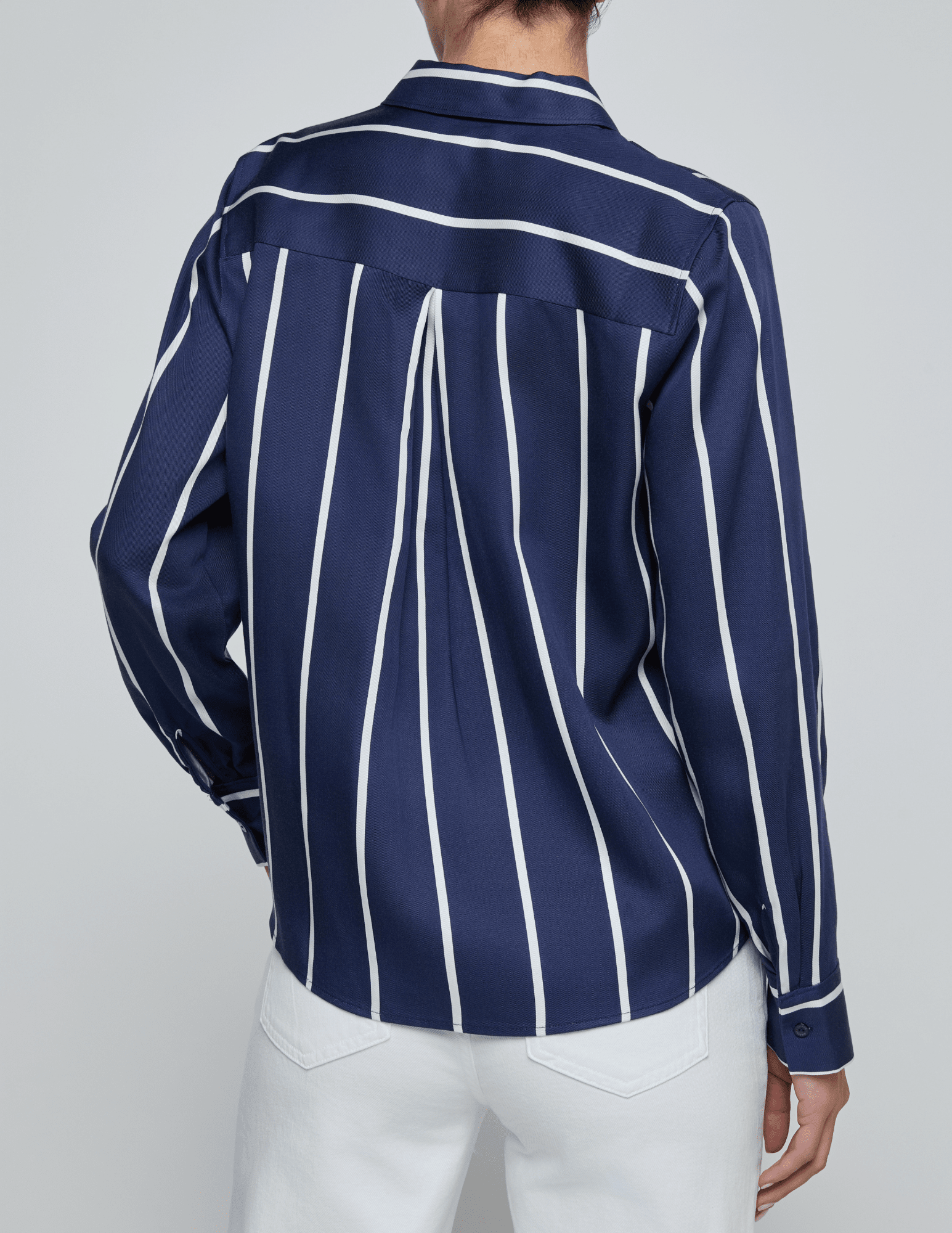 Back view of L’AGENCE Ellery blouse in midnight with white stripes