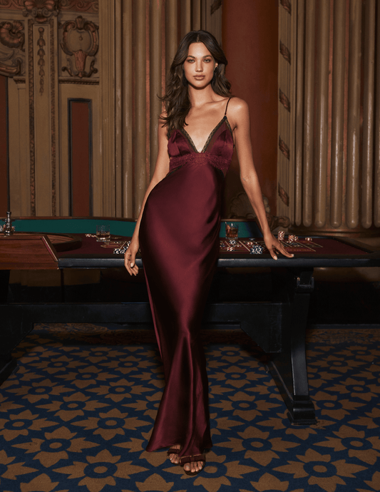 Model wearing L'AGENCE Elsa Silk Gown in Deep Port and Black with elegant silk charmeuse fabric