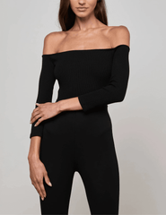 Model wearing L’AGENCE Evelyn Off Shoulder Bodysuit in black, front view