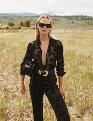 Editorial image of L’AGENCE Frances Velvet Bootcut Trouser in Black Butterfly