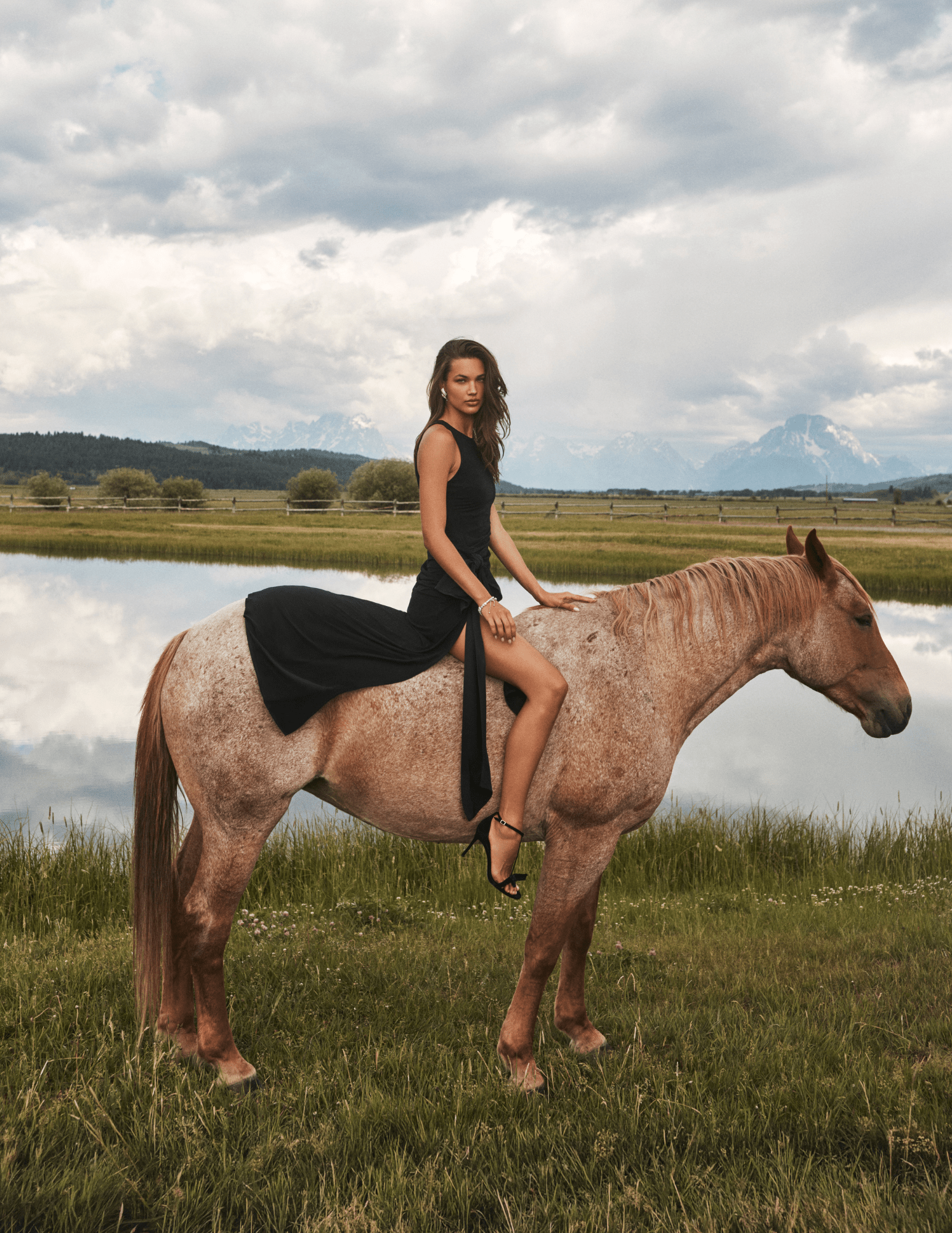 Lifestyle image of L'AGENCE Frost Bow Gown in Black