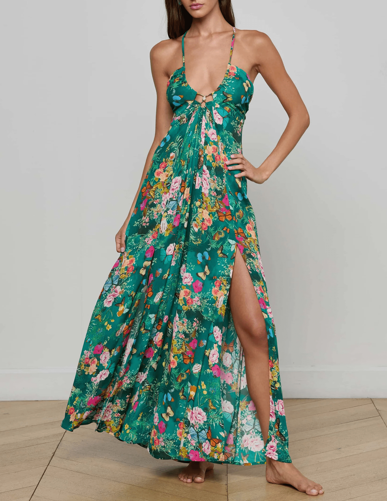 Front view of L’AGENCE Geneva Halter Maxi Dress in green butterfly print