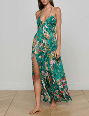 Side view of model wearing L’AGENCE Geneva Halter Maxi Dress with plunging neckline