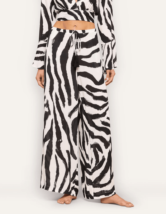 Front view of L'AGENCE Geraldine zebra print cover-up pants with adjustable drawstring waist.