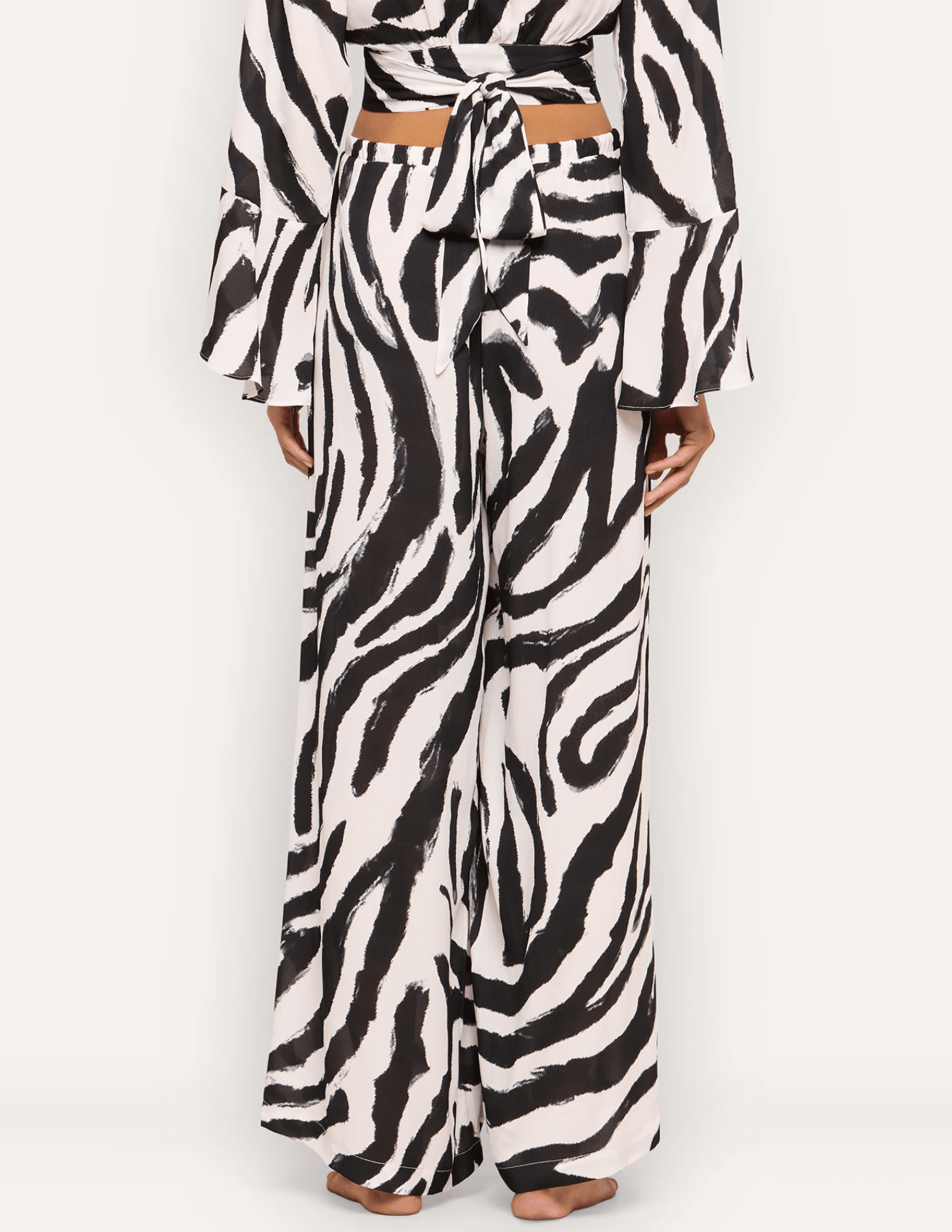 Back view of L'AGENCE Geraldine full-length zebra print cover-up pants.