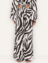 Back view of L'AGENCE Geraldine full-length zebra print cover-up pants.