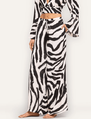 Side view of L'AGENCE Geraldine wide-leg zebra print resort pants.
