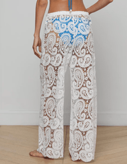 Model wearing L’AGENCE Geraldine white crochet cover-up pants- back