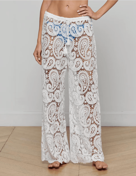 Model wearing L’AGENCE Geraldine white crochet cover-up pants front