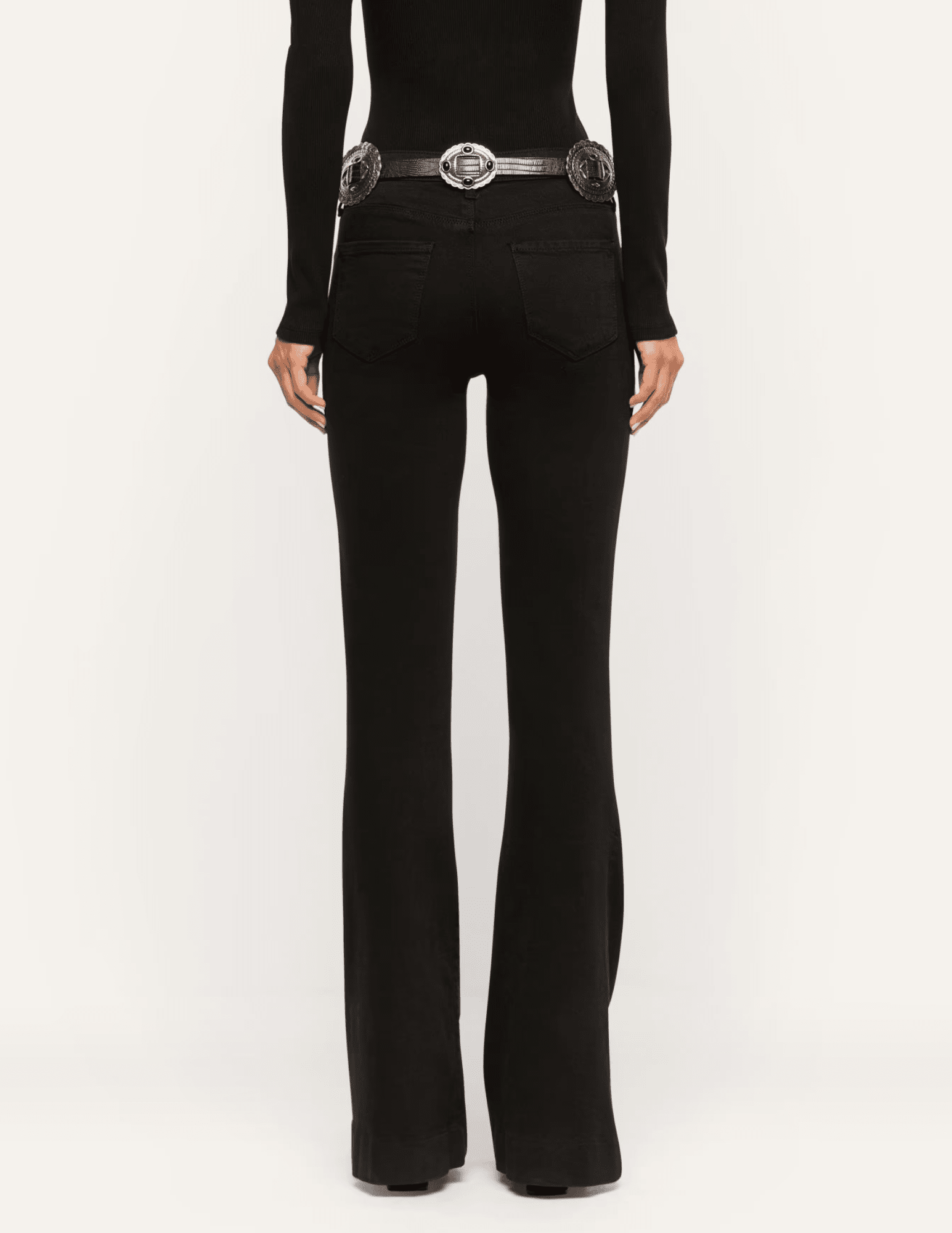 Back view of L'AGENCE Her Story black flare jeans showing the fitted silhouette and wide flared hems