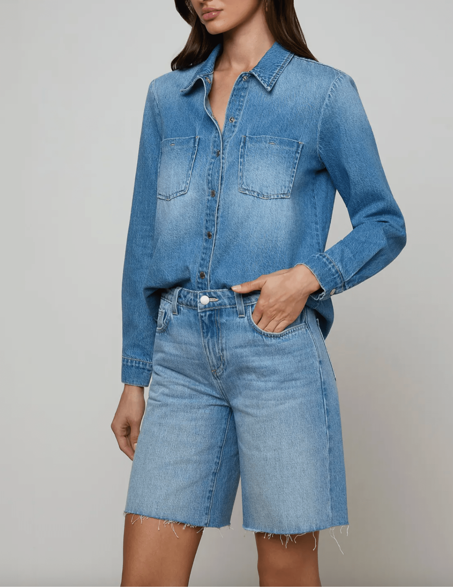 Side view of L'AGENCE Isla long sleeve denim shirt in Anaheim indigo wash
