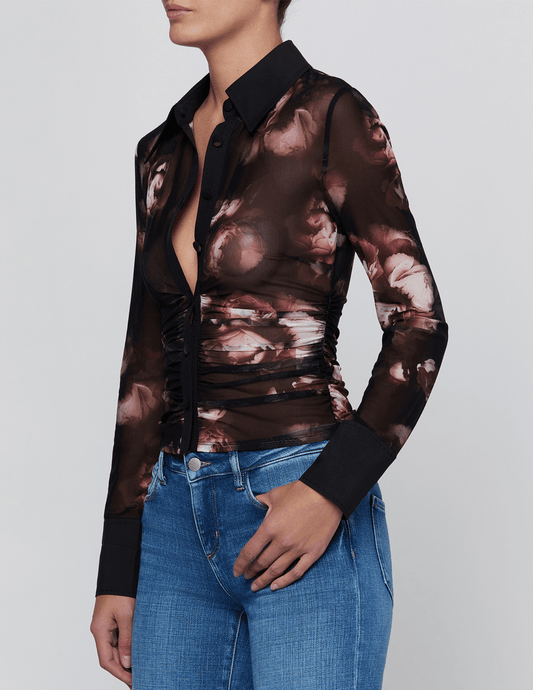 Angled view of L'AGENCE Isola mesh button-front top showing its fitted silhouette and side ruching.