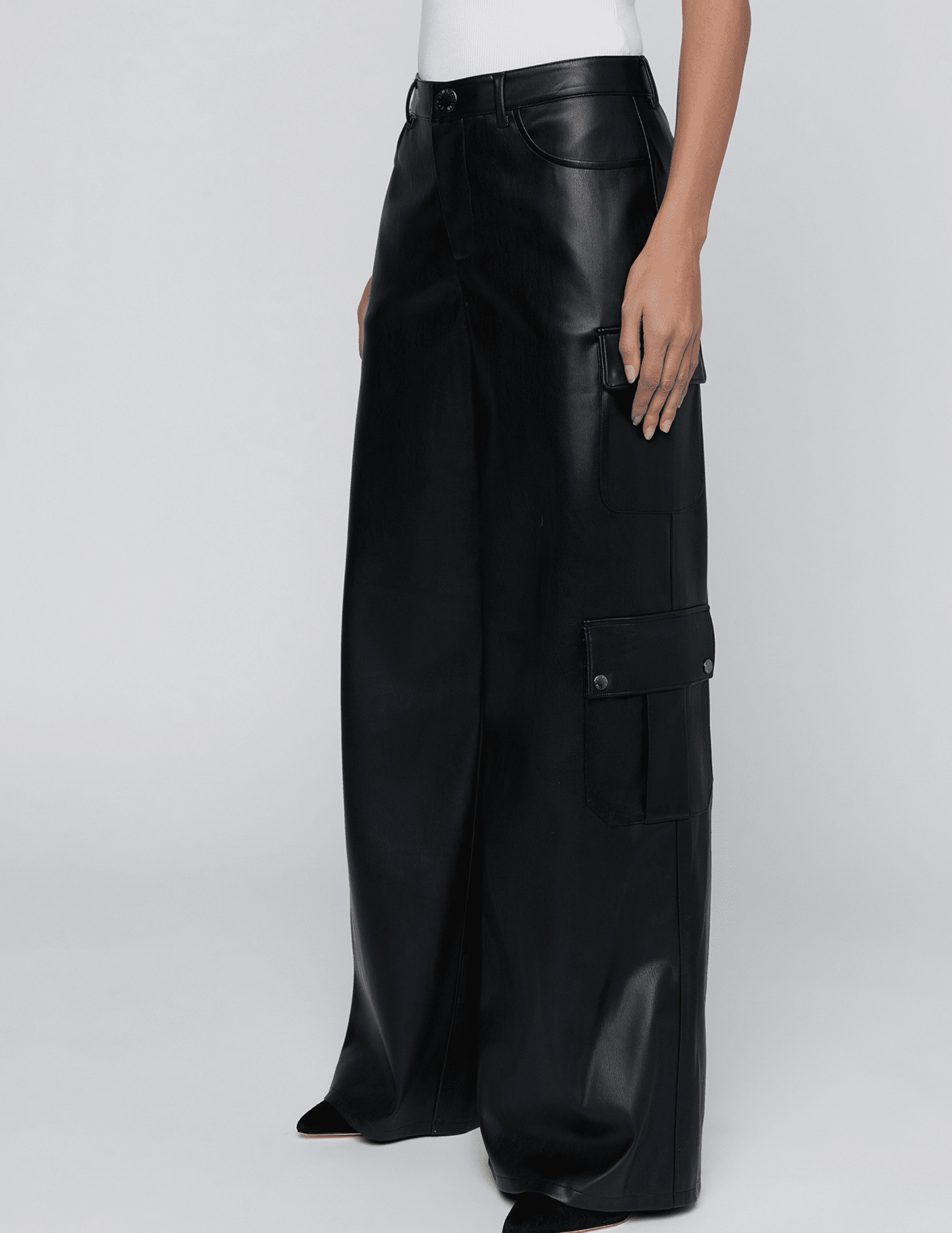 Side view of L’AGENCE Isolde Vegan Leather Cargo Pants in Black