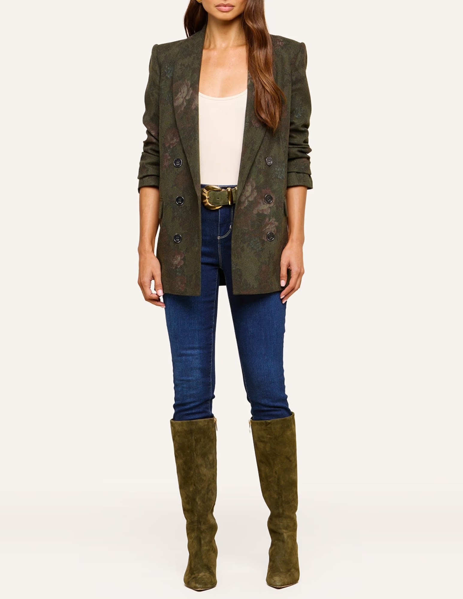 L'AGENCE Jayda Deep Forest Floral Blazer styled with blue denim jeans and knee-high boots.