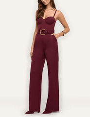 Side view of L'AGENCE Jessa tailored jumpsuit in Deep Port with sculpted bustier bodice