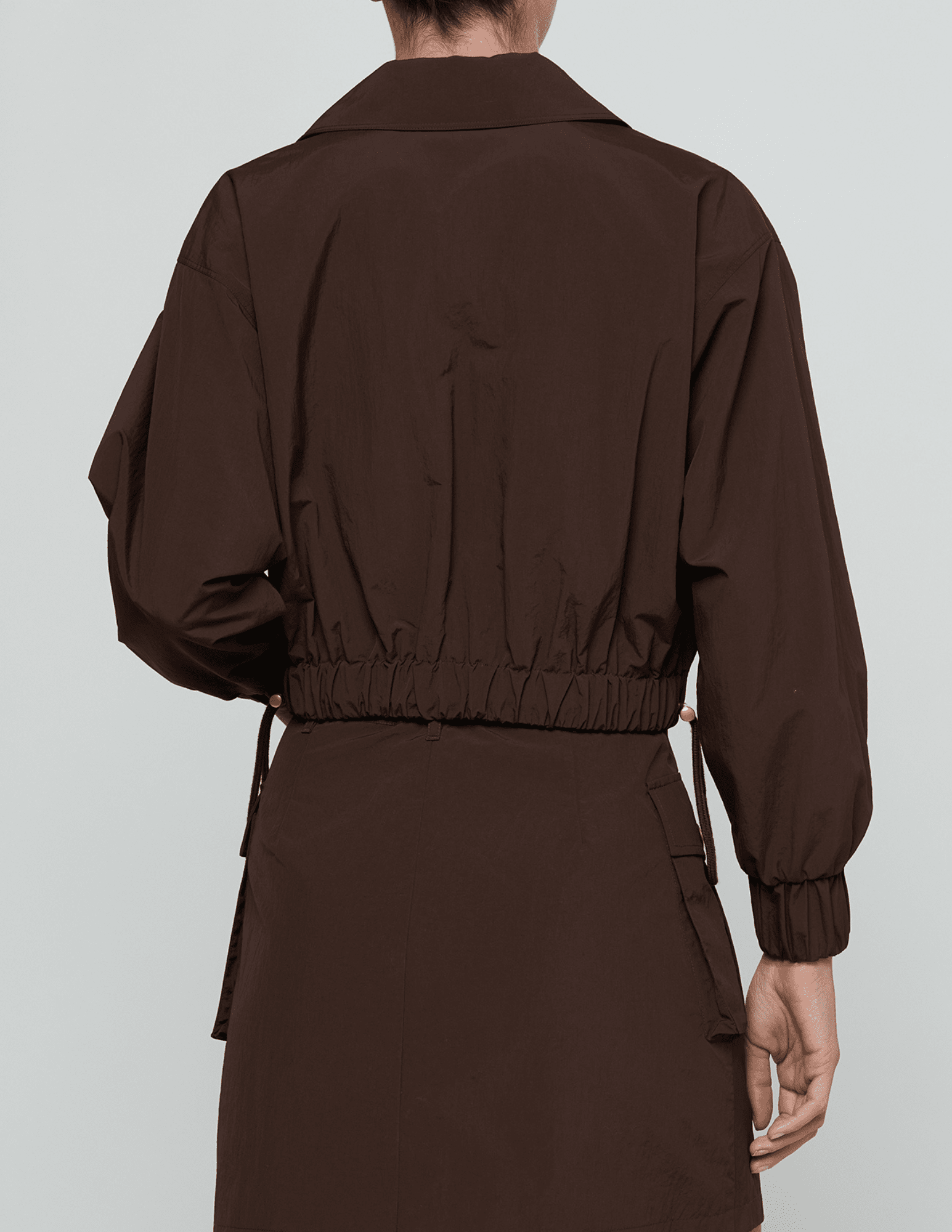 Back view of L'AGENCE Kade Cropped Windbreaker Jacket Dark Java