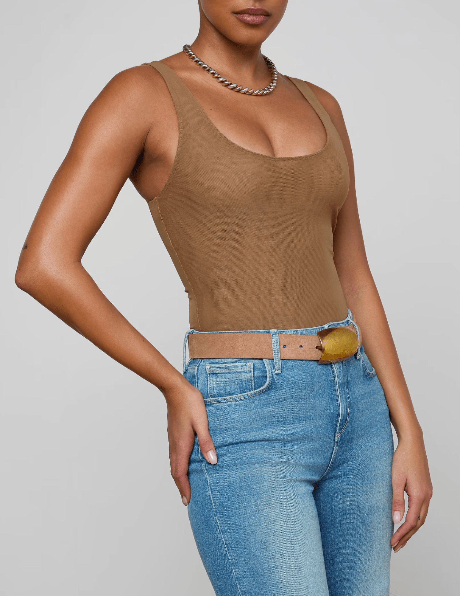 Model wearing L’AGENCE Kalea semi-sheer mesh bodysuit in dark macchiato