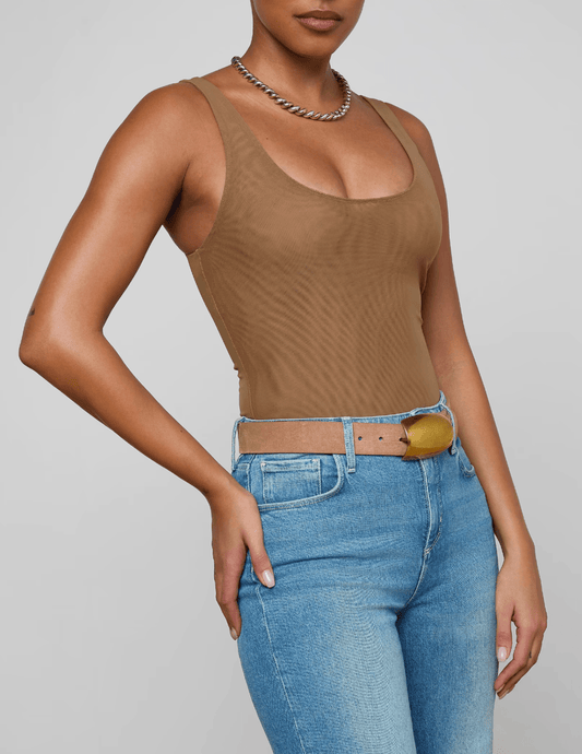 Model wearing L’AGENCE Kalea semi-sheer mesh bodysuit in dark macchiato