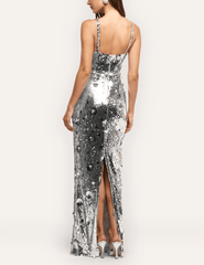 Back view of L'AGENCE Karma silver sequin maxi dress featuring a dramatic back vent