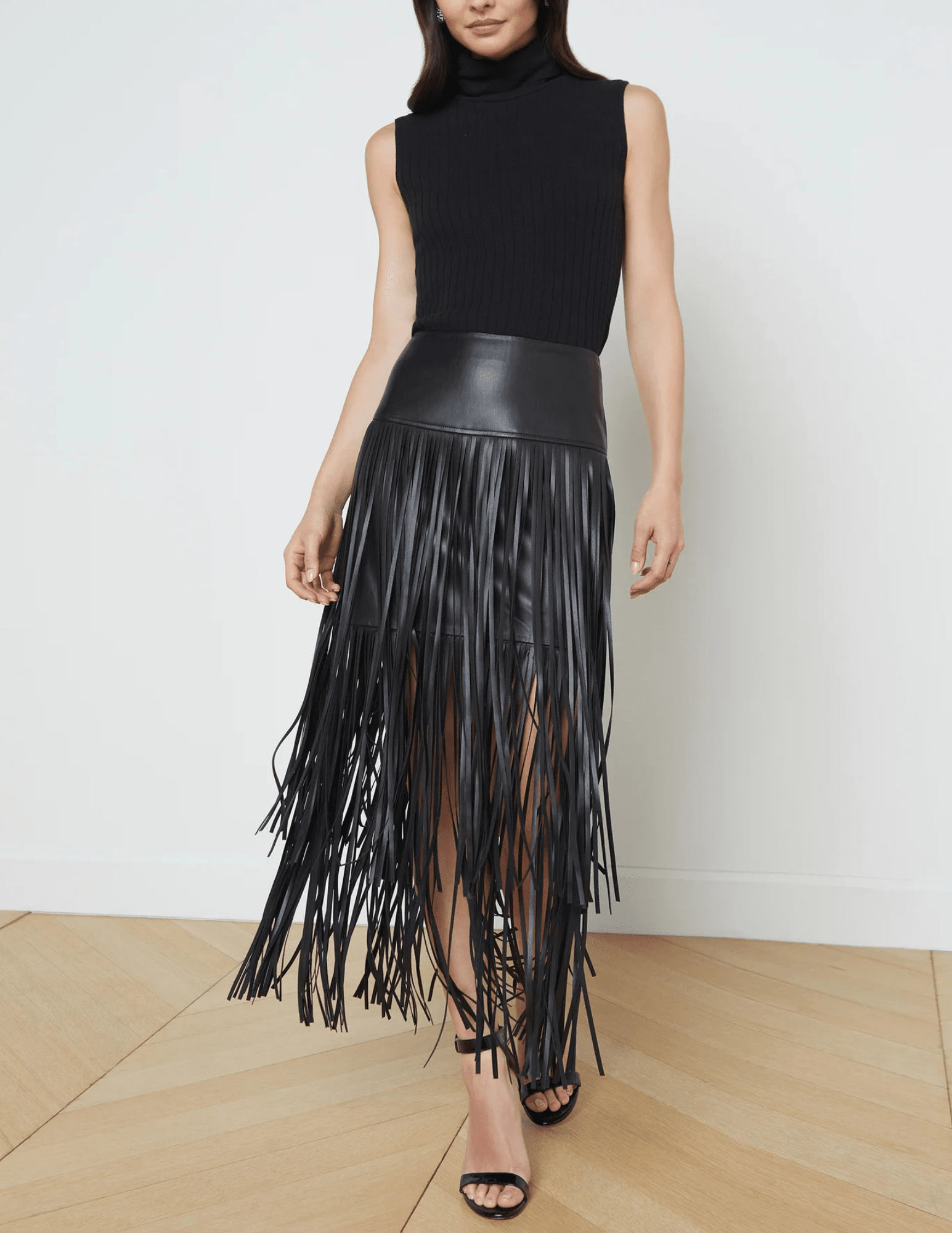 L’Agence Karolina Vegan Leather Fringe Midi Skirt in black with tiered fringe model view
