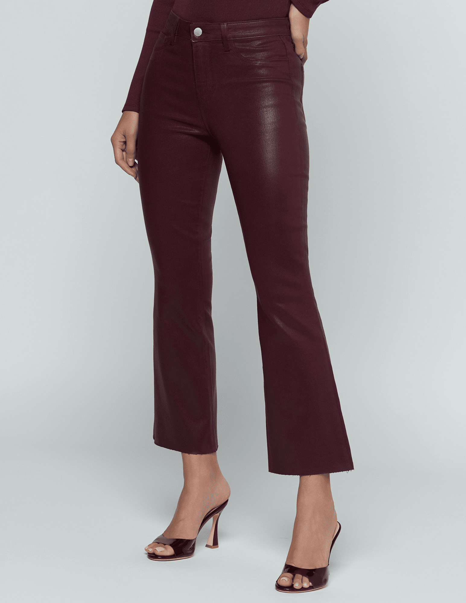 Side view of L'AGENCE Kendra High Rise Cropped Coated Jeans in Deep Sangria