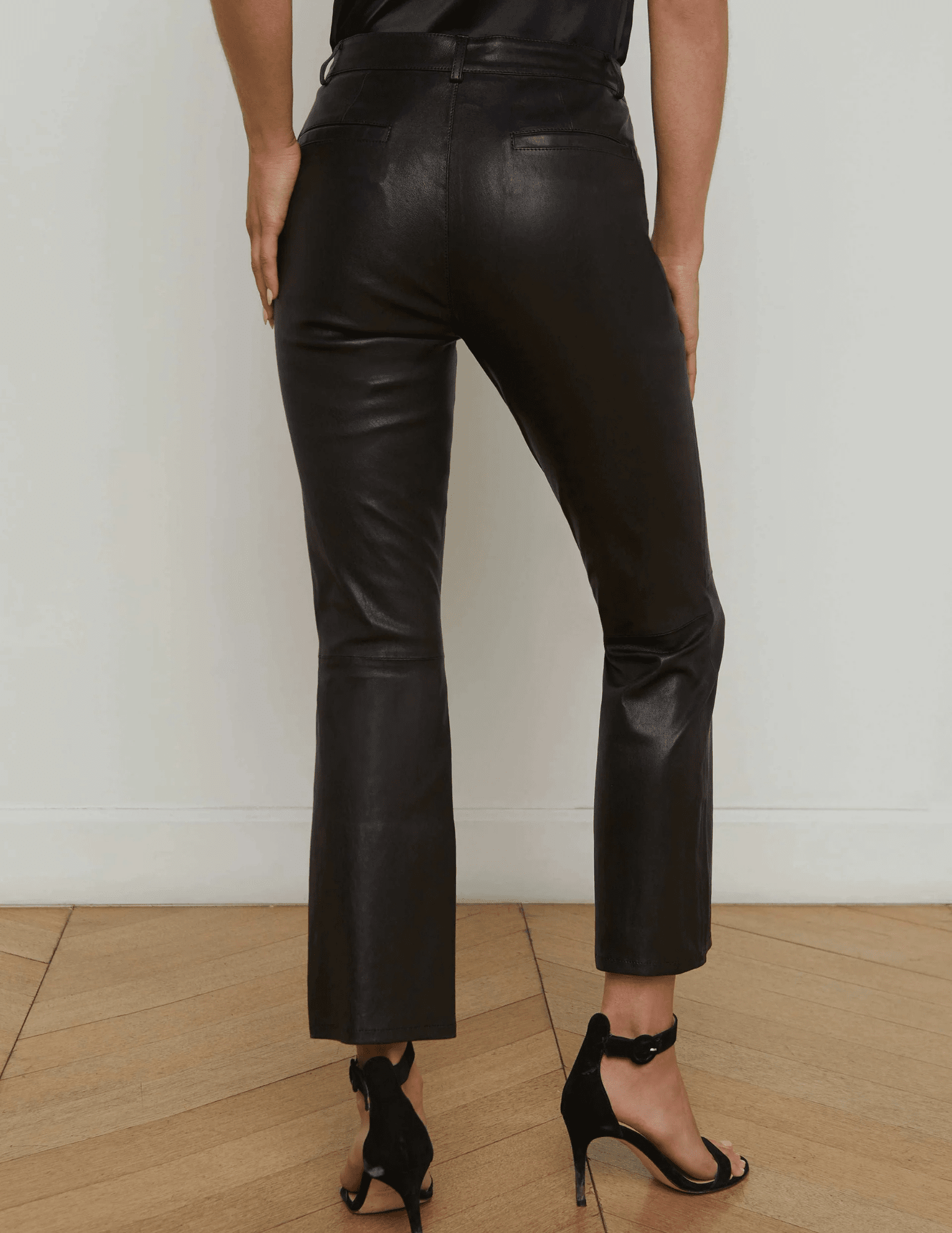 Back view of L’AGENCE Ketra Bootcut Trouser in Black with cropped hem.