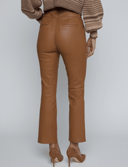 Back view of Ketra Leather Bootcut Trouser in Cognac with cropped hem.
