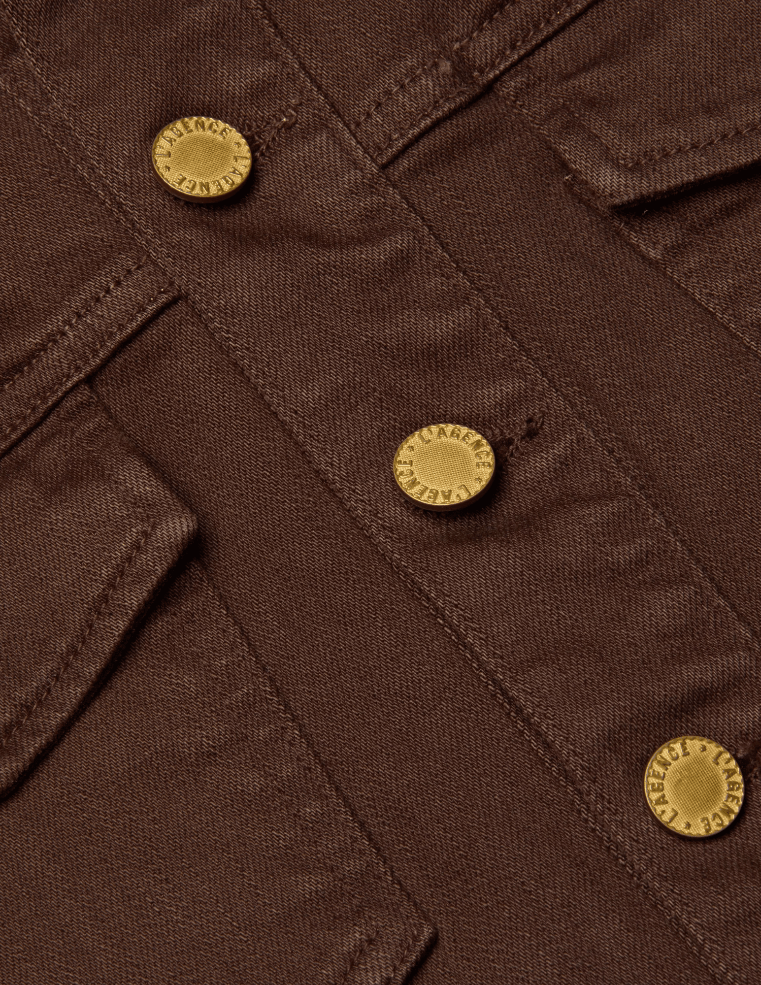 Front view of L’AGENCE Koda cropped denim jacket in brown with fringe and gold rivet buttons