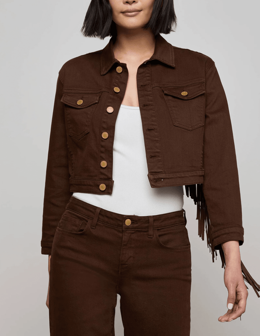 Front view of L’AGENCE Koda cropped denim jacket in brown with fringe and gold rivet buttons