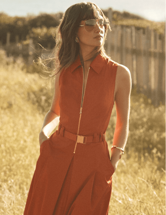 Model wearing L'AGENCE Kolton midi dress in Sienna outdoors