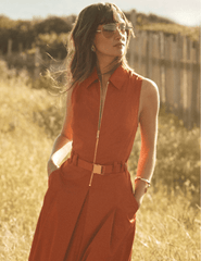 Model wearing L'AGENCE Kolton midi dress in Sienna outdoors