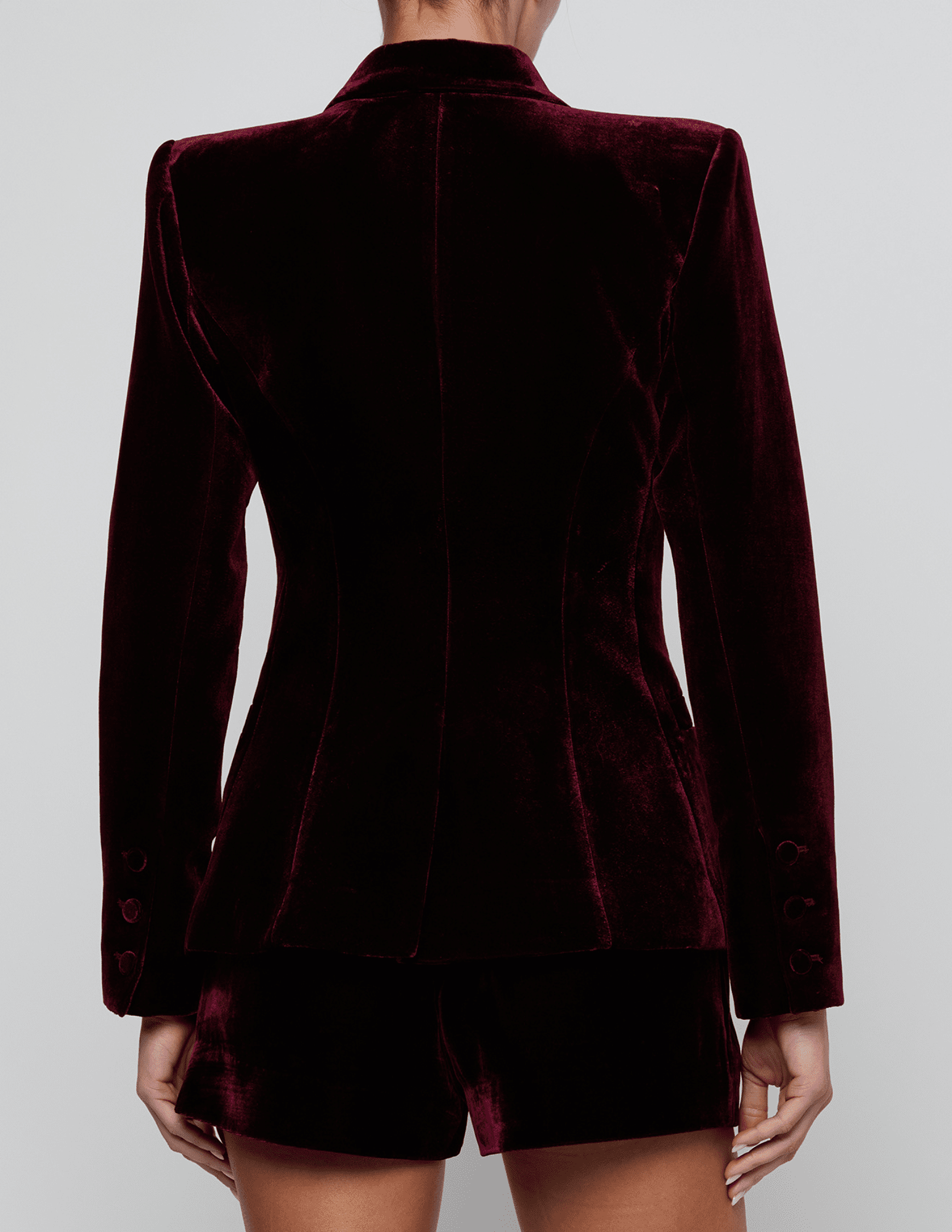 Back view of L'AGENCE Kyomi Deep Port Velvet Blazer showing its sculpted tailoring and luxurious velvet fabric.