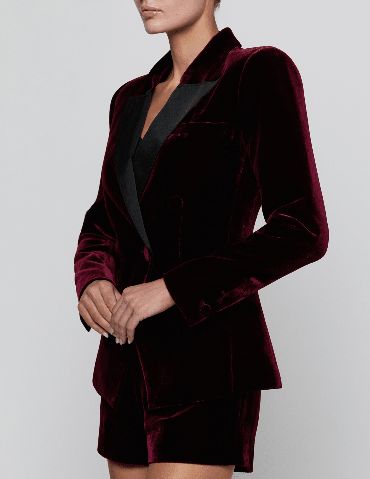 Side view of L'AGENCE Kyomi Deep Port Velvet Blazer showing its sculpted tailoring and luxurious velvet fabric.