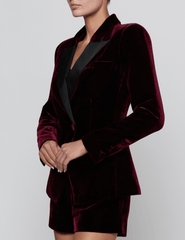 Side view of L'AGENCE Kyomi Deep Port Velvet Blazer showing its sculpted tailoring and luxurious velvet fabric.
