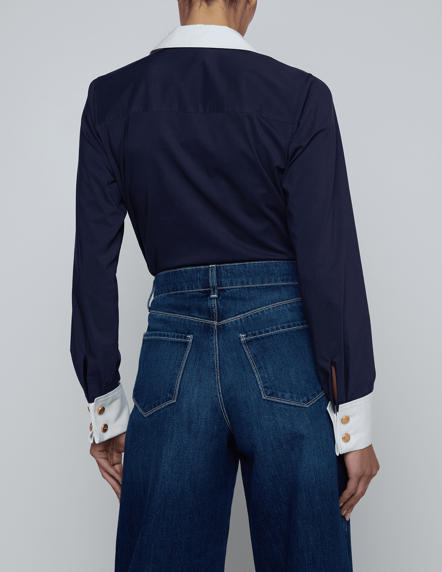 Back view of L’AGENCE Leslie bodysuit styled with denim