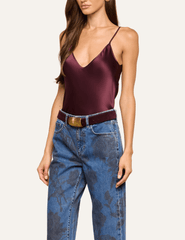 Side view of L'AGENCE Lexi silk camisole in Deep Sangria showing the elegant V-back and delicate adjustable straps.
