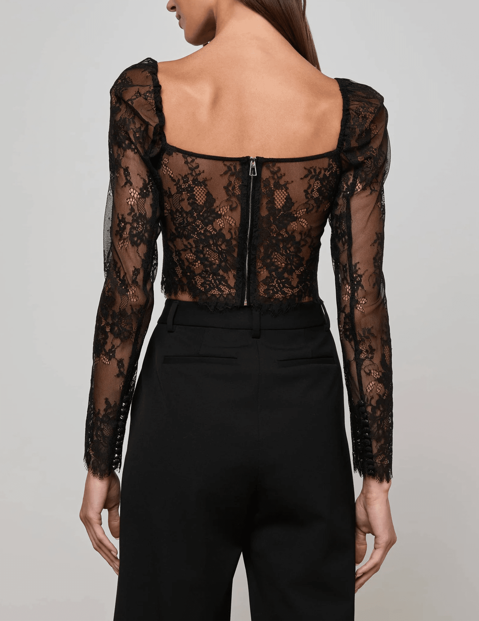 L’AGENCE Lori Lace Bustier Top in black floral lace with long sleeves back
