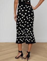 Back view L'Agence Mae knit midi skirt in black ecru polka dot