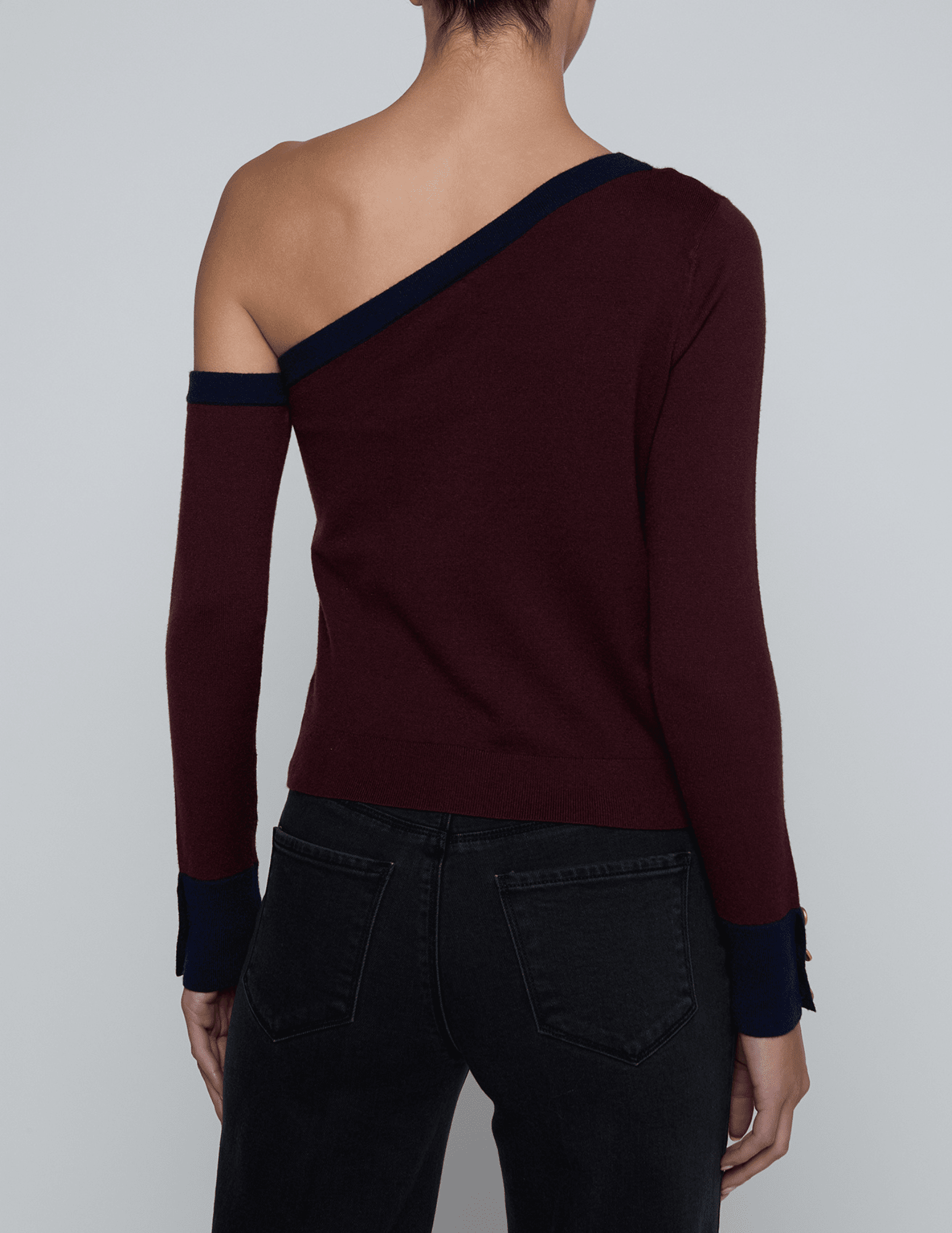 Back view of L’AGENCE Maeva Sweater with contrasting color-block trim.