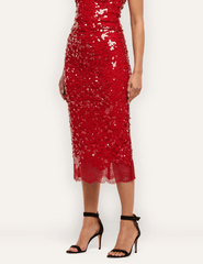 Side view of L'AGENCE Makena red sequin midi skirt showcasing its sleek pencil silhouette