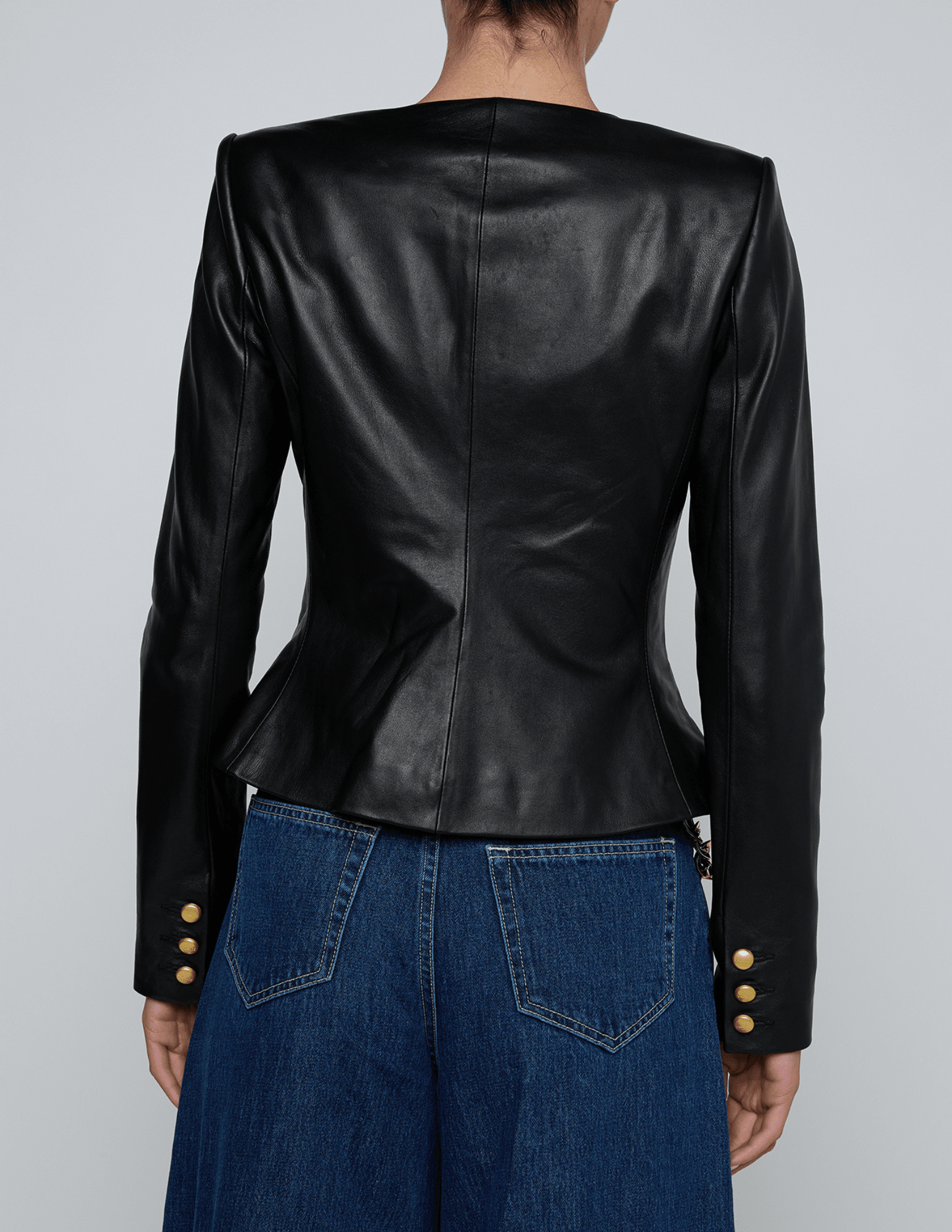 Back view of structured collarless leather blazer by L’AGENCE