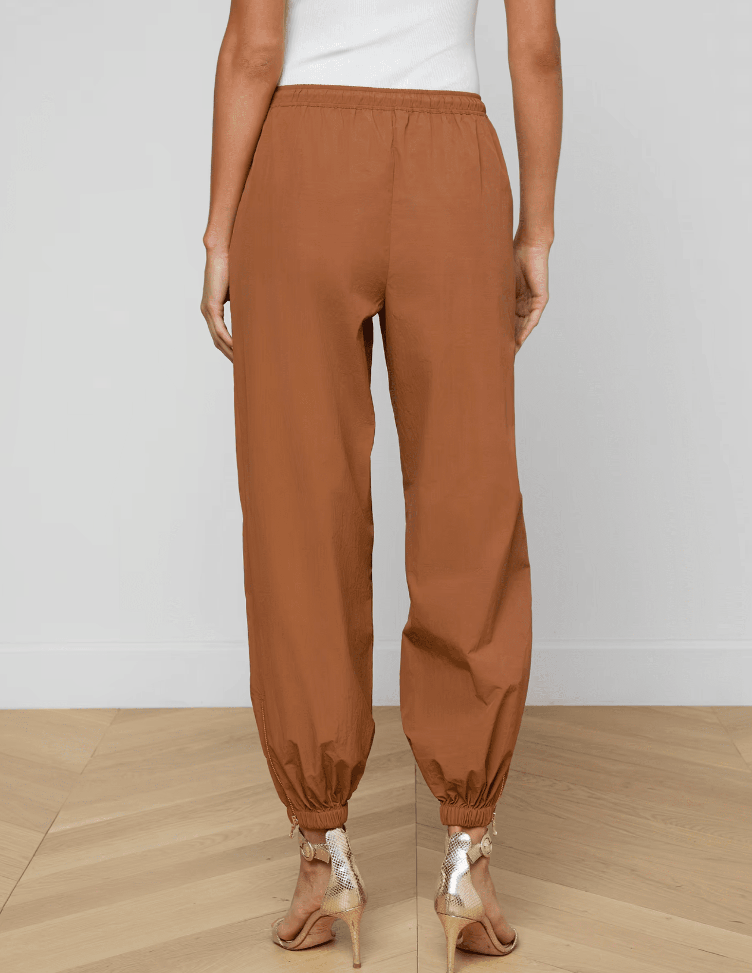 Back view of mid-rise fawn jogger pants with elastic hem