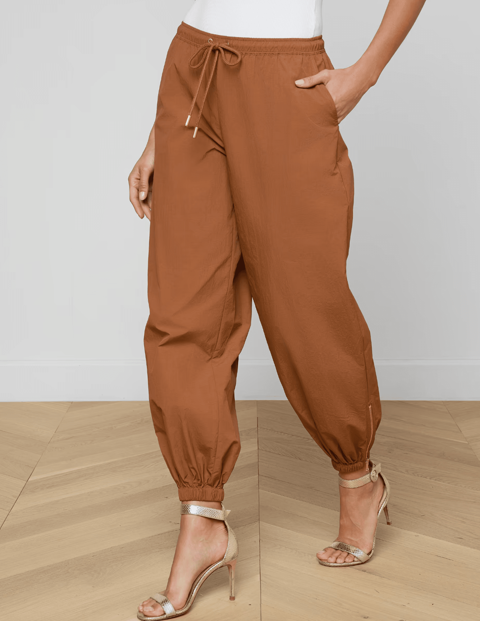 Side view of mid-rise fawn jogger pants with elastic hem