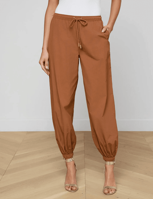 Front view of fawn jogger pants with tapered ankle